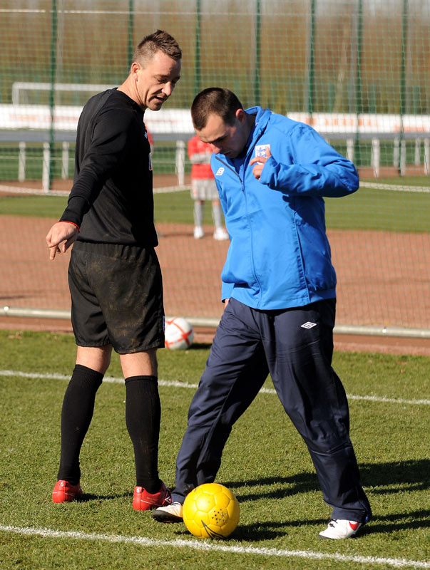 John Terry watches Craig Lundberg in action.